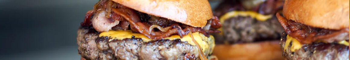 Eating American (Traditional) Burger at Boulevard Burgers & Tap House restaurant in St Pete Beach, FL.